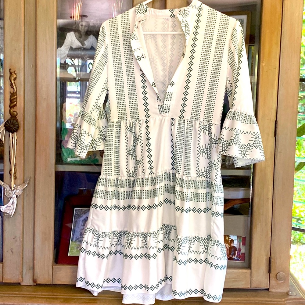 Mid length mainly white with green design dress